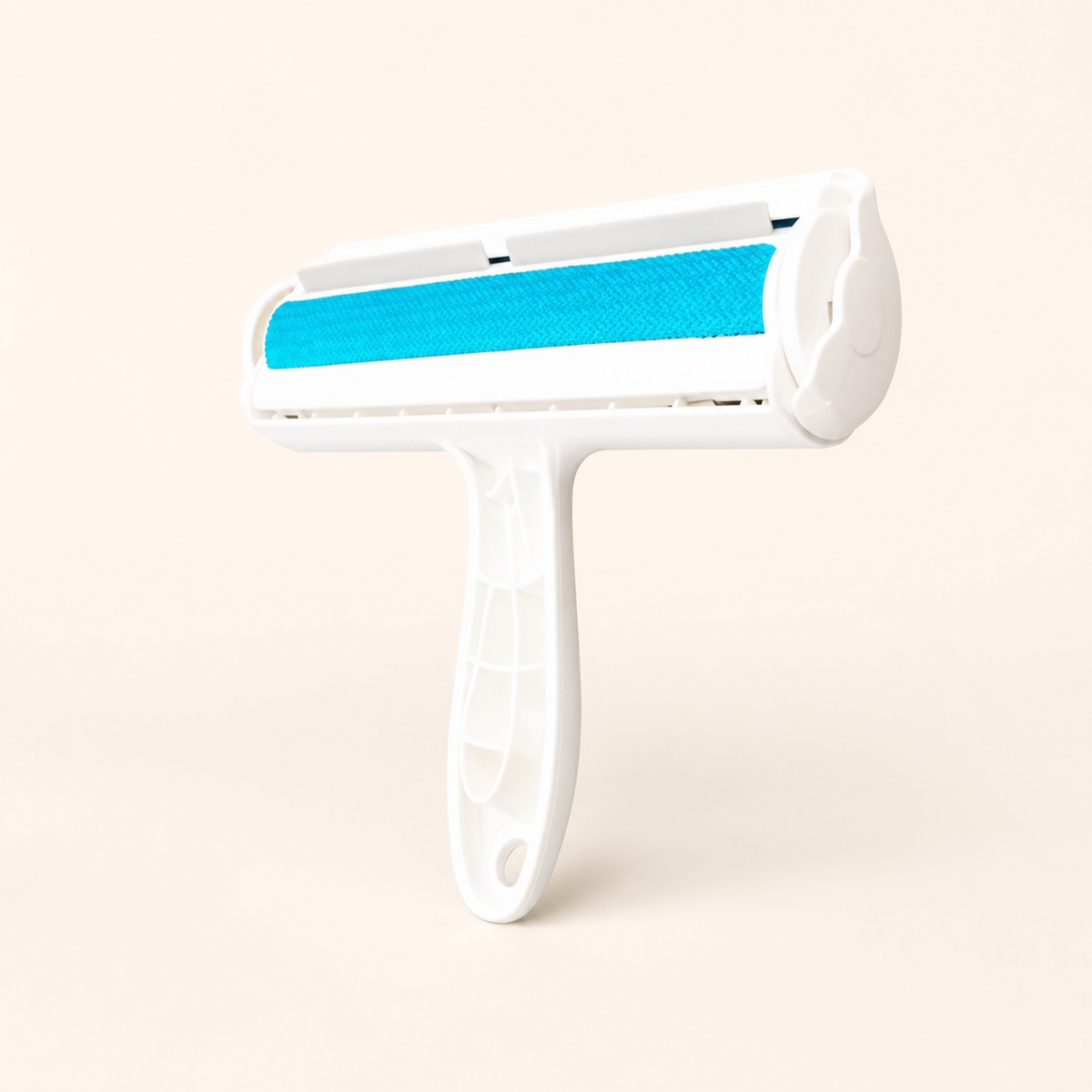 Whisker & Wow pet hair remover roller in blue on a cream background