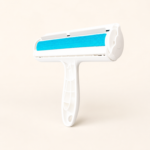 Whisker & Wow pet hair remover roller in blue on a cream background