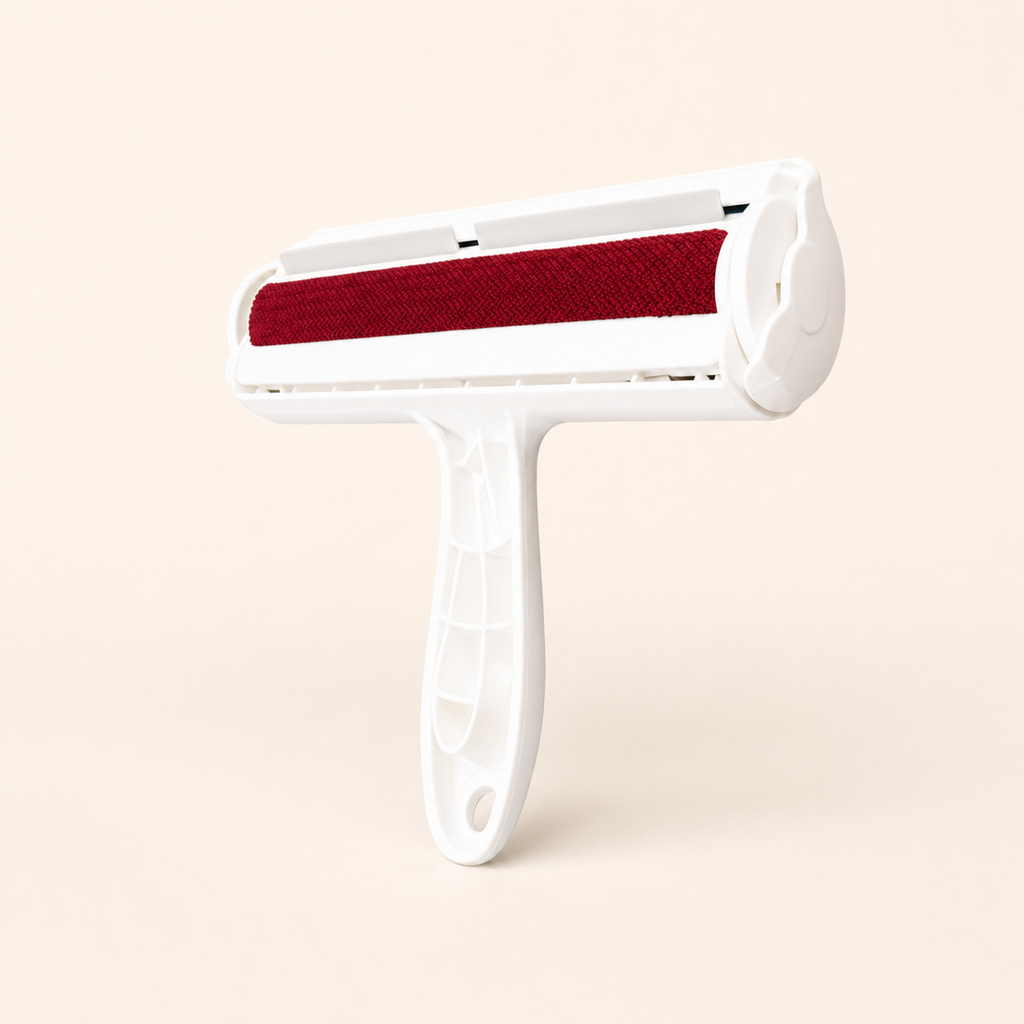 Whisker & Wow pet hair remover roller in red on a cream background