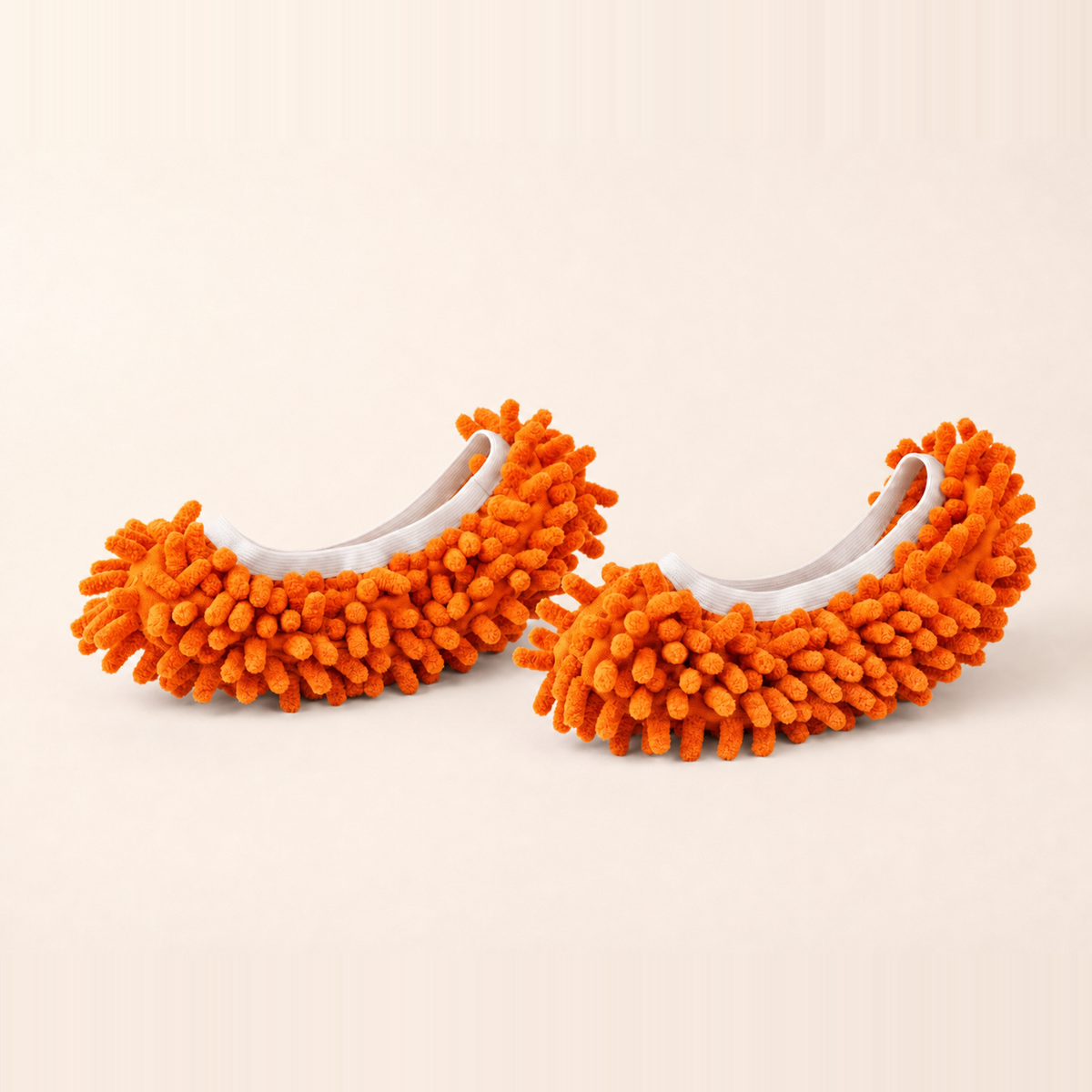 Whisker & Wow fur-catching slippers in orange on a cream background